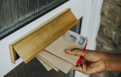 Woman picking up the mail